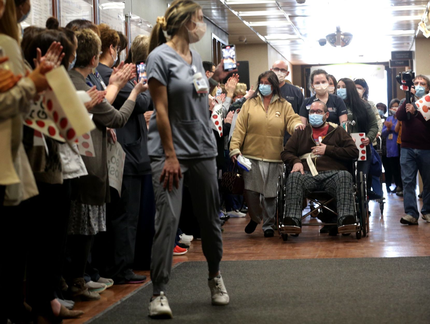 Staff cheers as COVID-19 survivor Joshua Miller discharged from St. Luke's Hospital